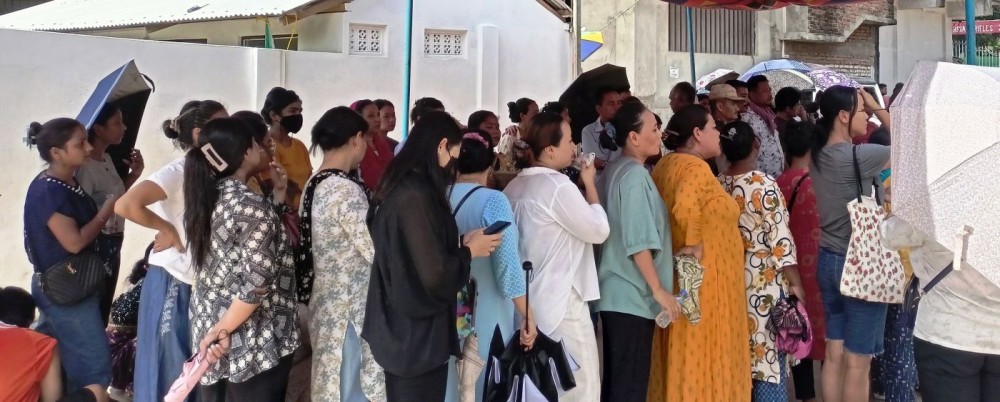 A group of Naga women along with others wait in queue to cast their votes during a general election in Nagaland. (Morung File Photo)
